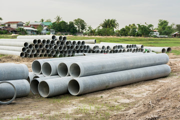 stacked of concrete, cement pipes. concrete pipes for irrigation at construction site