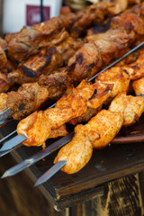 Appetizing meat grilled on skewers. Cooking shashlik. Grilling pork on coal