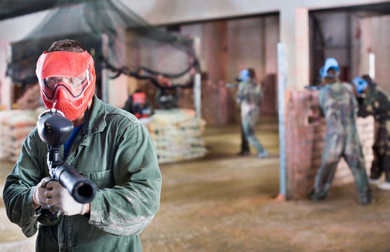 Player in red mask in paintball club