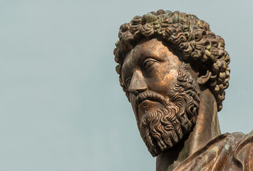 Ancient statue of emperor Marcus Aurelius, a bronze replica of 2nd century AD statue in the center of Capitol Hill Square in Rome (with copy space) - obrazy, fototapety, plakaty
