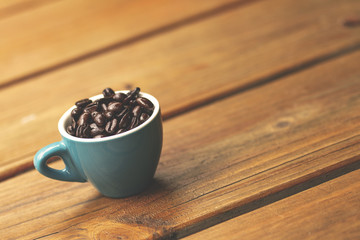 Coffee beans in blue cup