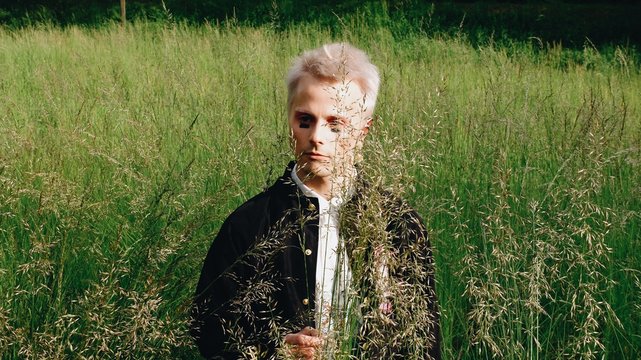 A portrait of a blond man