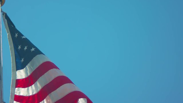 Slow-motion footage of an American Flag blowing in the breeze.  Shot on a Blackmagic Ursa Mini Pro 4.6k with a Canon FD 70-210mm f/4.