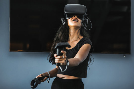 South-East asian girl playing VR game