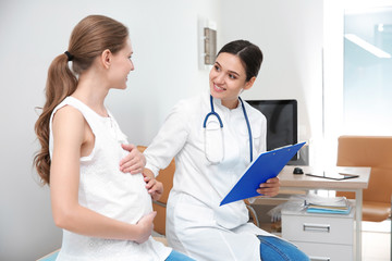 Pregnant woman having appointment at gynecologist office