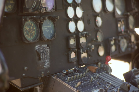 The inside of an old abandoned UH-1 military helicopter. cockpit 