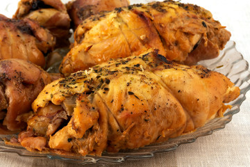 Meat dish - baked rolls, twisted from slices of meat, laid on a glass plate.