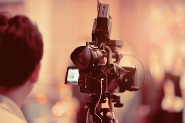 videographer close up , cameraman , movie, man with camera, movie, professional camera