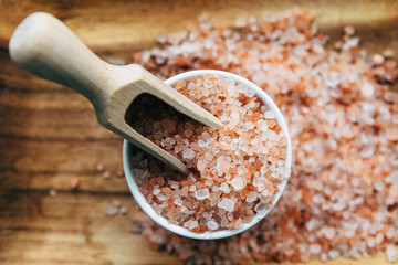 Himalayan pink salt in wooden spoon