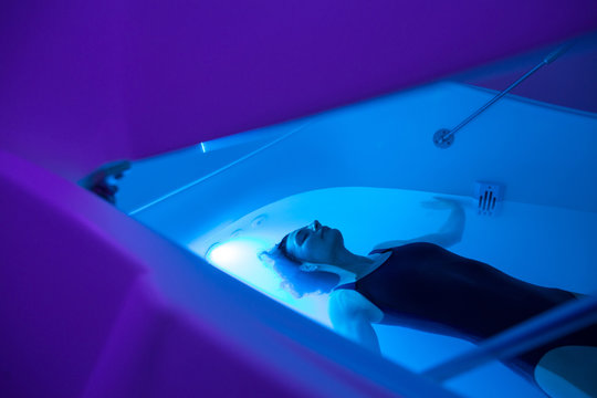 Relaxed woman during sensory deprivation float experience