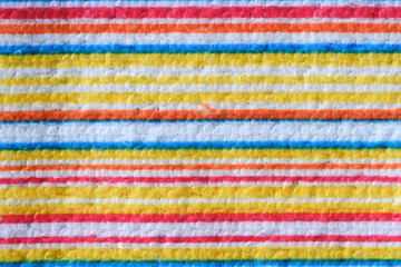 Striped beach towel useful as a background pattern