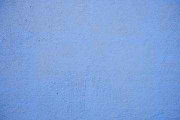 Blue stucco wall background, painted cement wall texture