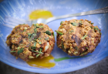 falafel with vegetables lavash wrap cup to two pieces on plate close up photo
