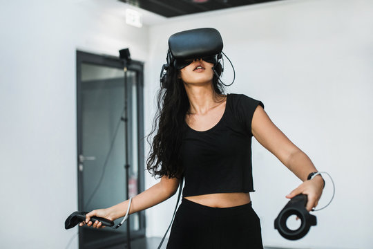 South-East asian girl playing VR game
