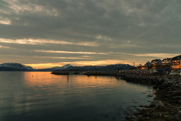 landing stage at a small harbour in Narvik / Norway at midnight with midnight sun