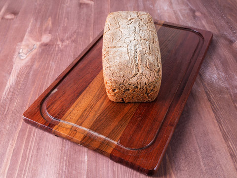 Freshly baked bread on dark gray kitchen table