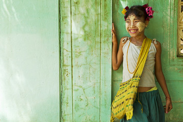 Young burmese girl with Tanaka on her face