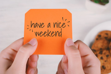 Woman hands holding note paper with text 