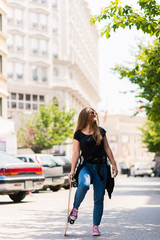 Fototapeta na wymiar Teenage Girl Holding Skateboard Outdoors Portrait
