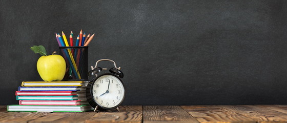 Back to School Concept with Stationery Supplies and Blackboard