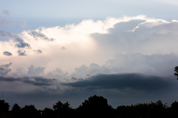 Close-up of cumulus clouds forming with silver lining