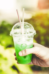 year cocktail. A cocktail with ice cubes and straws in hot weather. thirst for the tropics with fruits.drink