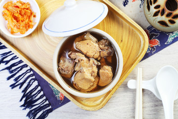  Black garlic chicken soup on the table 