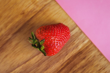 strawberries in a pink background