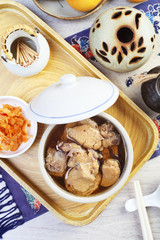  Black garlic chicken soup on the table 