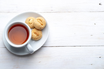 Top view tea and peanut cookies, copy space