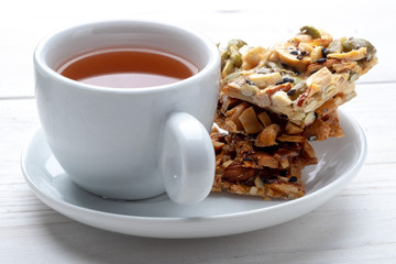 Tea and homemade Florentine, traditional almond cookies.