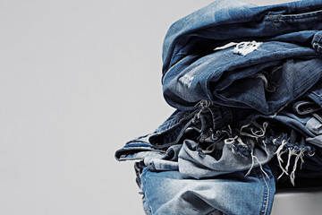 a pile of blue jeans