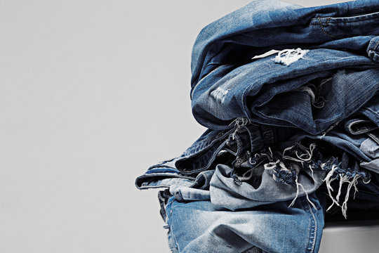 a pile of blue jeans