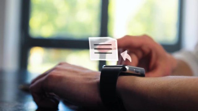 Close up of businessman hands checking іncoming notification on smart watch. Animation of hologram envelope message, mail, letter, futuristic email. Future digital technology concept.