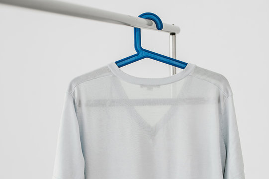Light-blue t-shirt on a hang