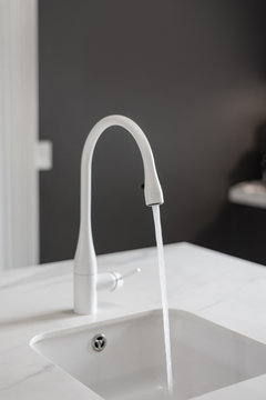 White Kitchen Tap With Water Running