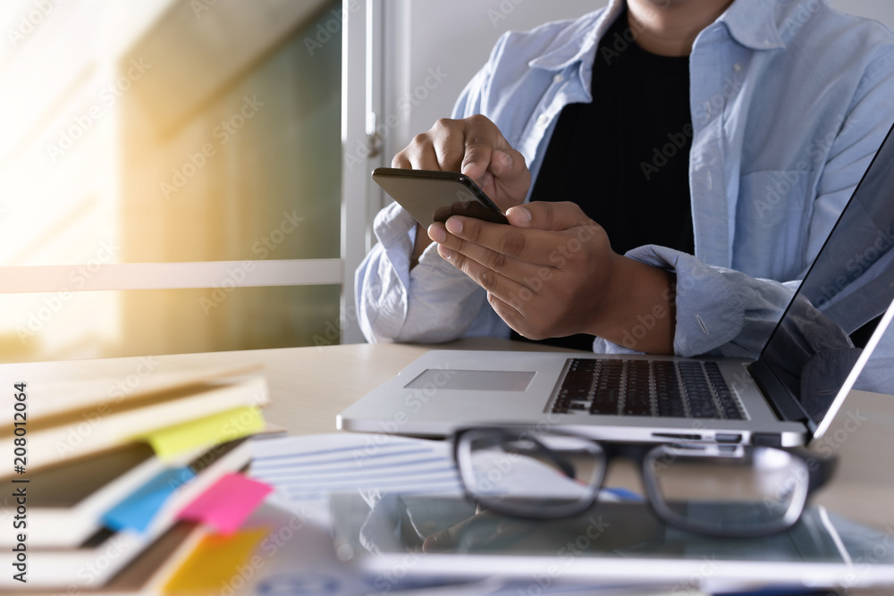 Poster businessman using phone smart phone and notebook computer