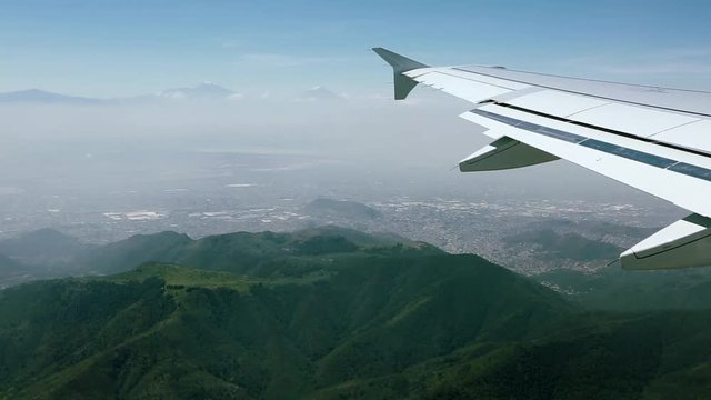 Aerial view from an airplane over mountains in Mexico City