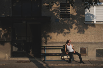 Tired Man Sitting On The Bench