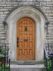 Fototapeta na wymiar wooden door with stone frame