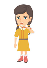 Caucasian little girl brushing her teeth. Happy girl cleaning her teeth. Cheerful girl holding toothbrush in hand. Vector sketch cartoon illustration isolated on white background.