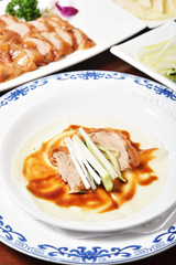 Peking Duck - Chinese roast duck served with  spring onion and hoisin sauce, wrapped in pancakes.      