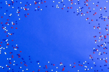 USA holiday decorations on a blue background flat lay