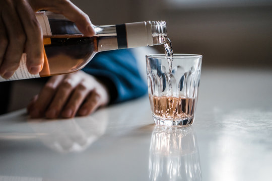 Pouring a glass of ros? on a summer evening