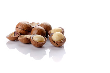 Macadamia nut with shell on white background