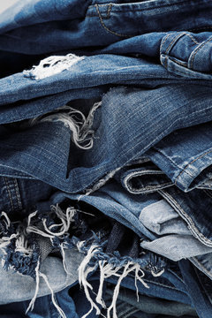 a pile of blue jeans