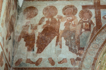 Painted byzantine saints on a church wall