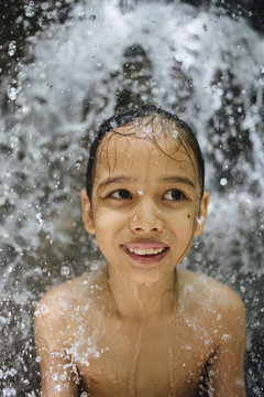 Boy at waterfall