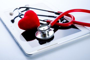 Red heart, stethoscope on tablet pc, health medical technology concepts