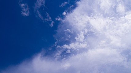 Blue sky with white clouds background.